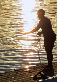 Kado holds the tether so that prevents the novice from floating down steam out of control.